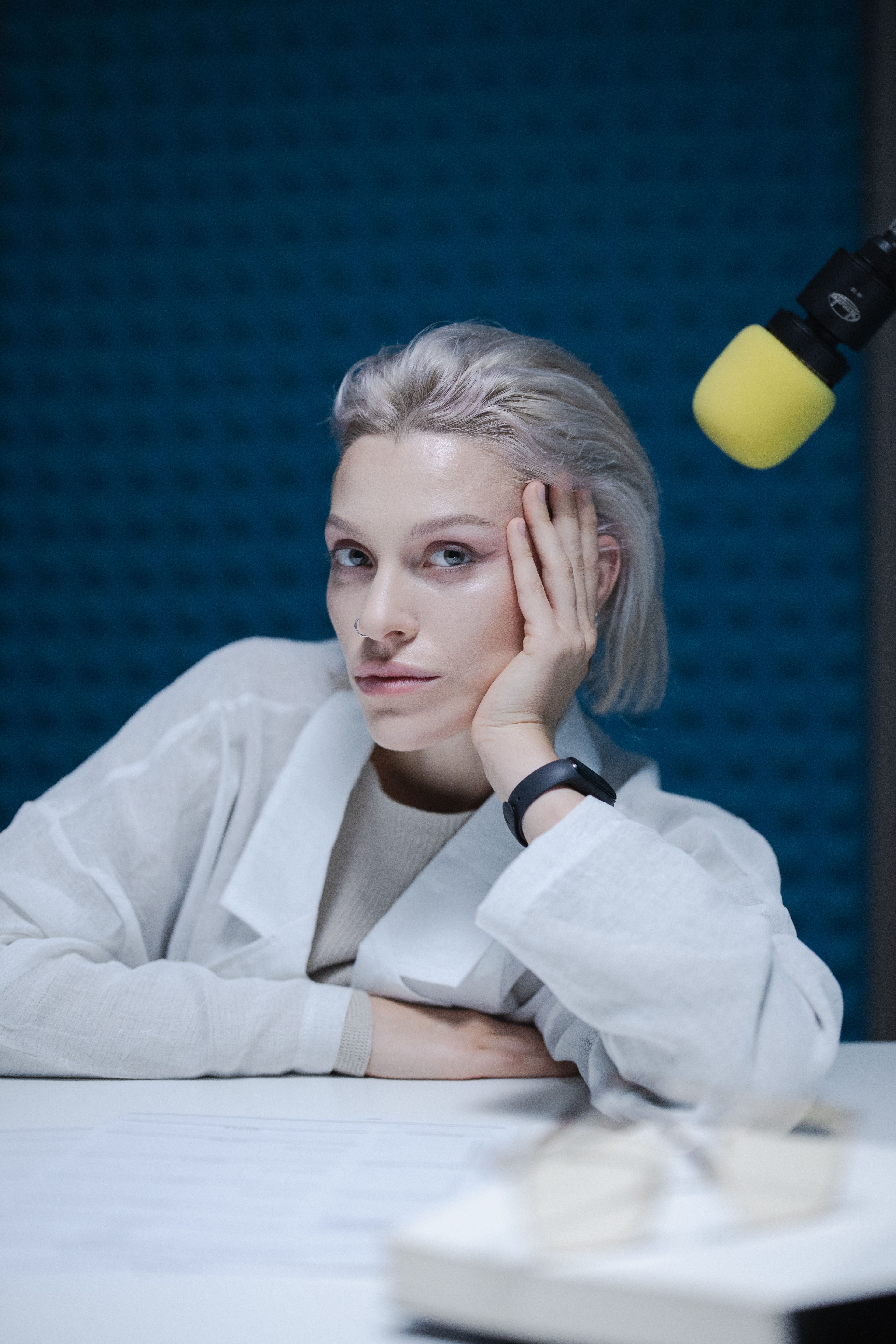 The host at the studio microphone, mid-thought