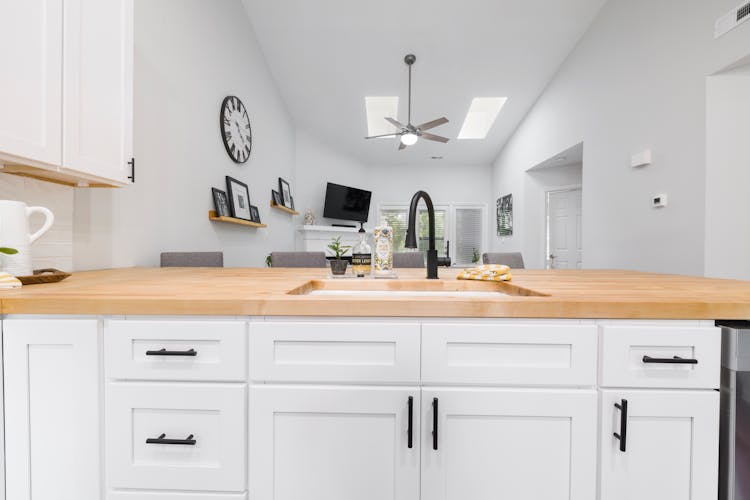 White Wooden Cabinets In Kitchen