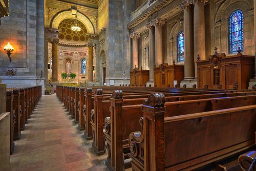 Free Beautiful interior view of Saint Paul Cathedral's aisle, showcasing stained glass and ornate architecture. Stock Photo