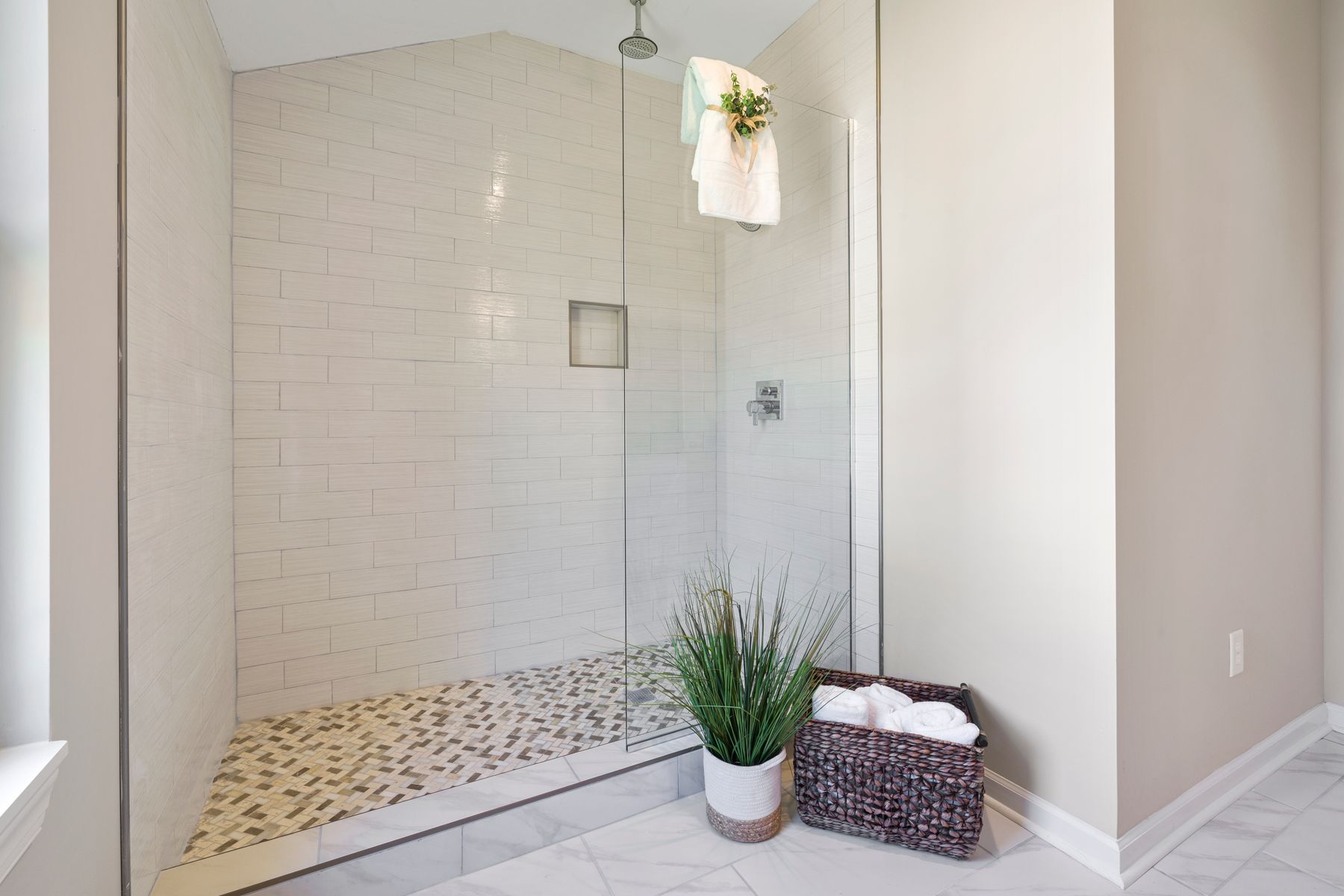 Minimal shower with simple tiled surfaces, clear entry and coordinated wet-zone details