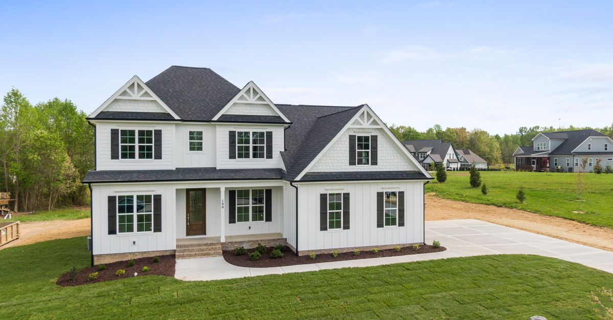 Aerial view of a modern two-story house with spacious lawn in Youngsville, NC.