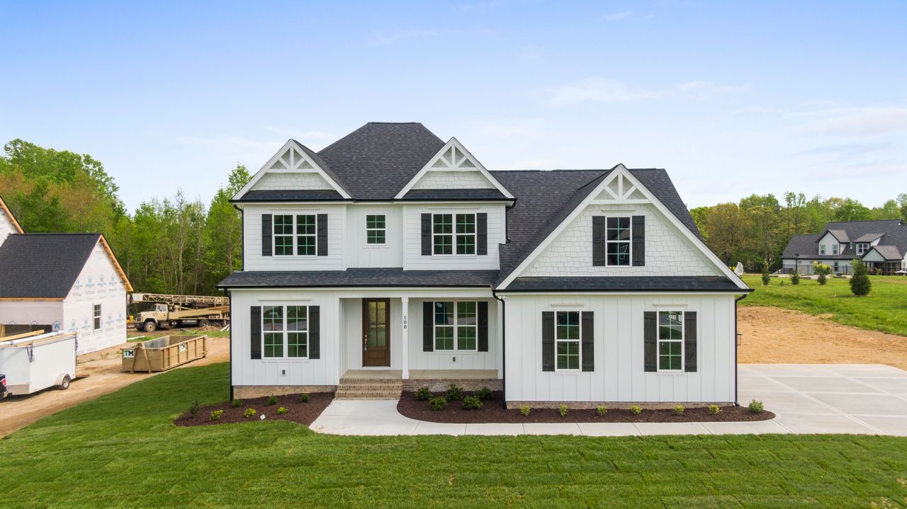 contemporary suburban home with landscaped lawn located in youngsville