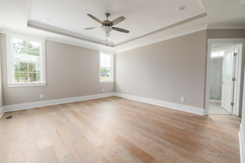 Free Brown Wooden Parquet Floor and White Wall Stock Photo