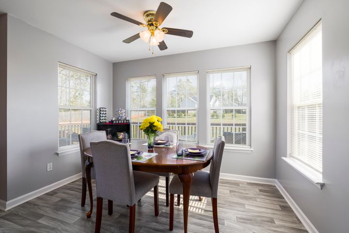 Ceiling fan installation in an Orem home Modern ceiling fan installed above a wooden dining table