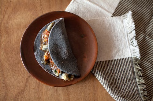 Free Overhead Shot of a Taco on Top of a Brown Plate Stock Photo