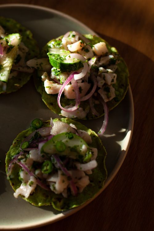 Free Delicious Mexican ceviche tostadas with fresh seafood and vegetables on a plate. Stock Photo