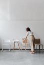 Woman Holding a Chair