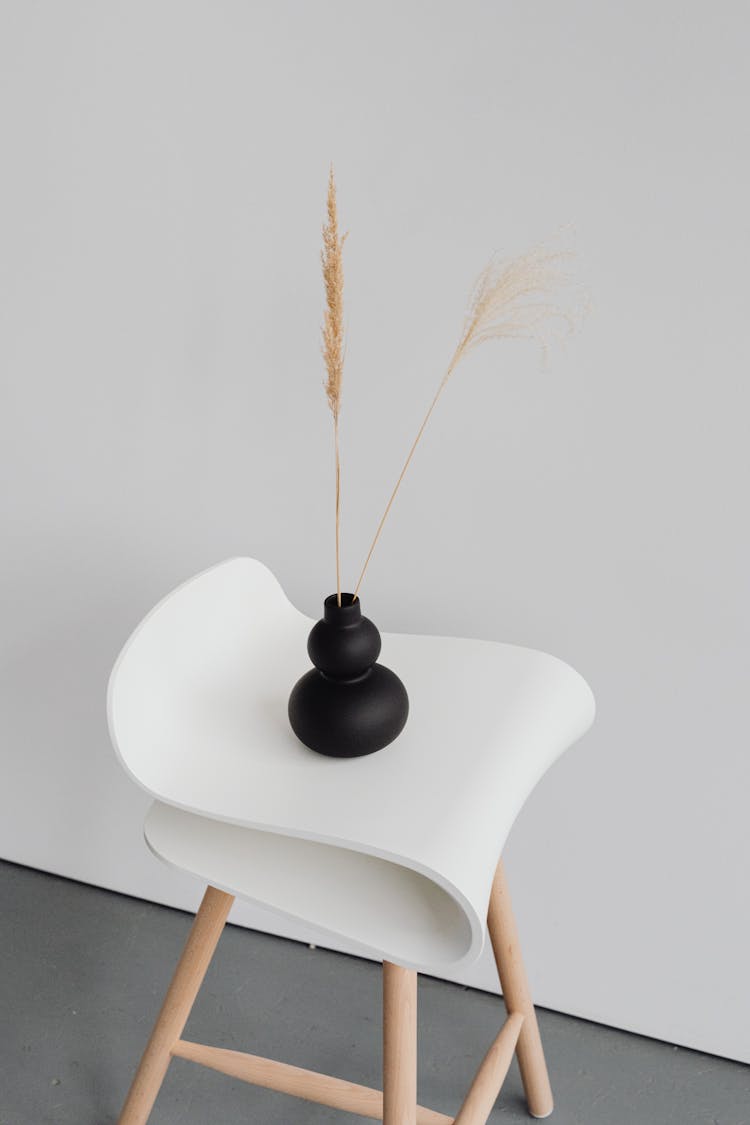 Black Vase Standing On Futuristic Coffee Table