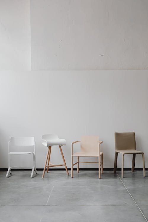 Design Chairs in Line near Wall