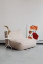 A Chair and an Abstract Painting on a Canvass