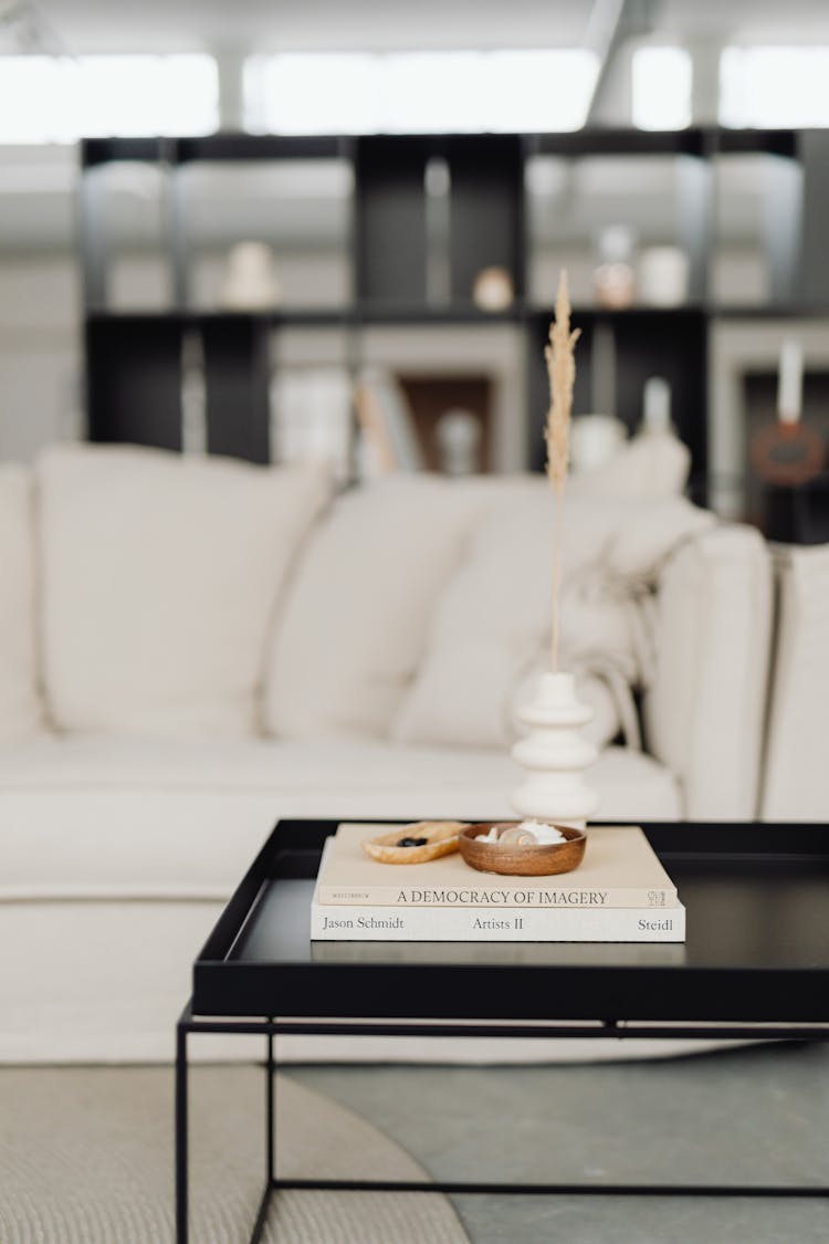 Books And Decorative Ornaments On A Center Table