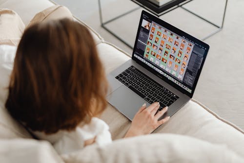 Free Woman Using a Laptop Stock Photo