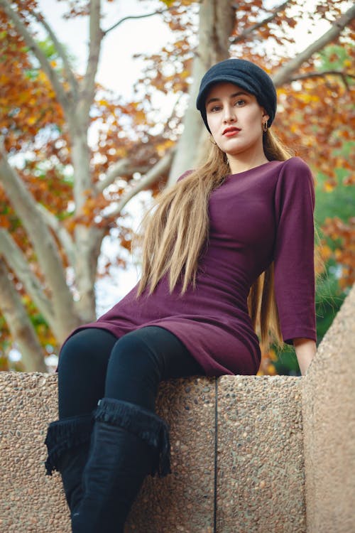 Low-Angle Shot of a Woman in a Violet Top Looking at the Camera
