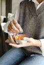 A Person Holding a Can of Gummy Candy
