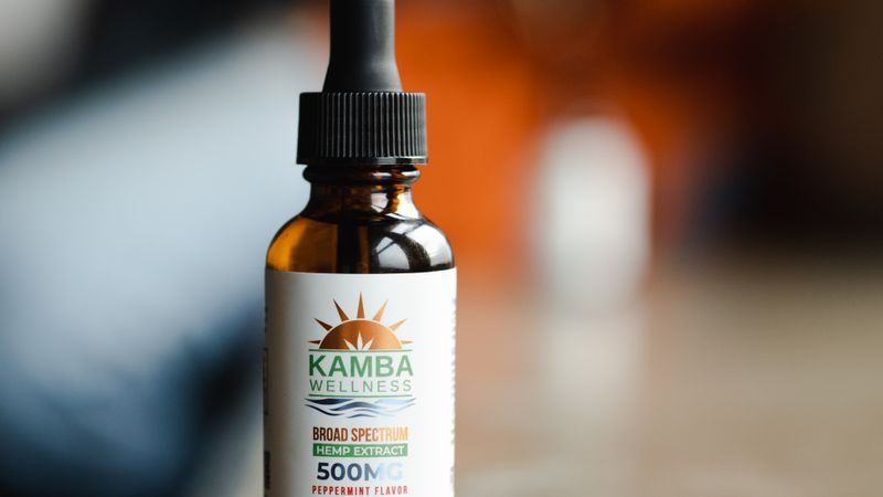 CBD topical applied to jaw for TMJ pain and tension relief