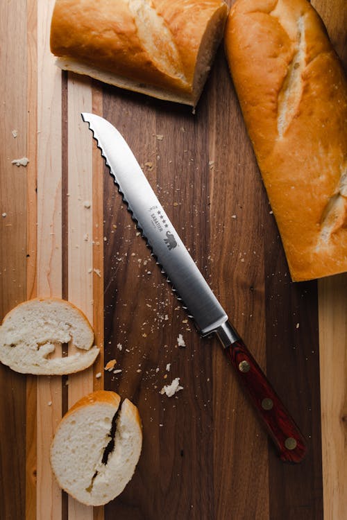 Radish Knife On Textured Kitchen Board Stock Photo 1699624450
