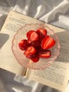 Strawberries in Bowl on Book