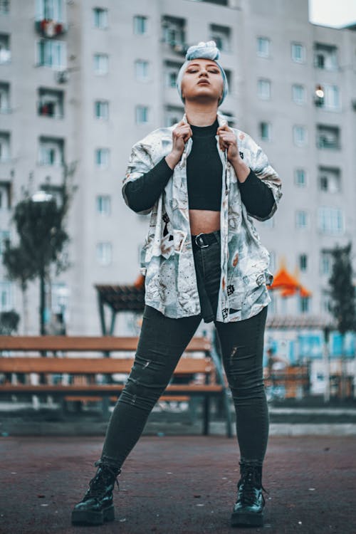 Woman Wearing a Printed Shirt Standing on the Street