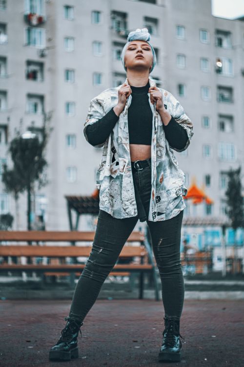 Free Fashionable woman in streetwear posing confidently outdoors in Tbilisi, Georgia. Urban vibe. Stock Photo