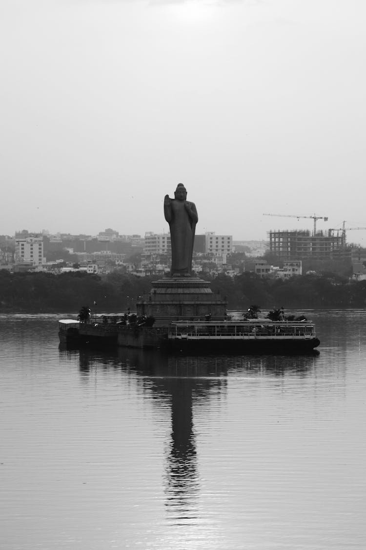 Grayscale Photo Of The Statue Of Gautama Buddha In Hussain Sagar Lake In India