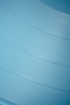 A minimalist close-up of blue vinyl texture, ideal for artistic backgrounds.