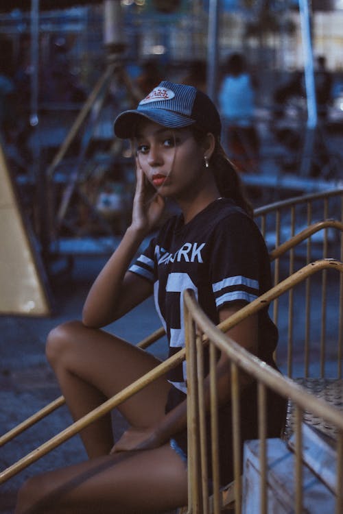 Woman in Black and White T-shirt and Von Dutch Cap
