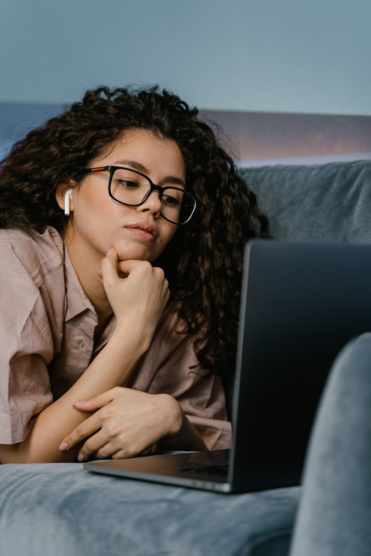 Close Up Photo Of Woman Looking At The Screen Of A Laptop