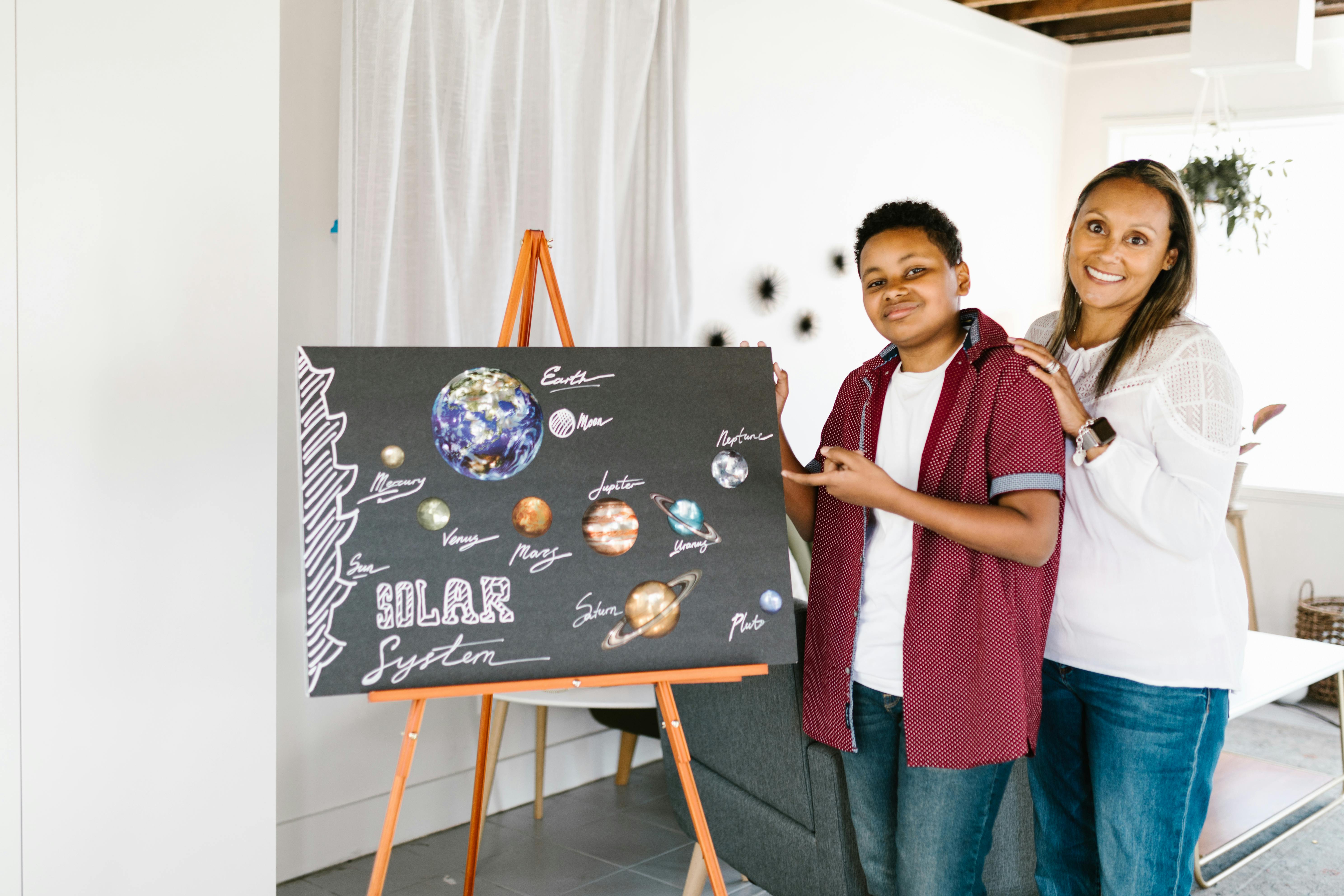 mother and son posing with school project