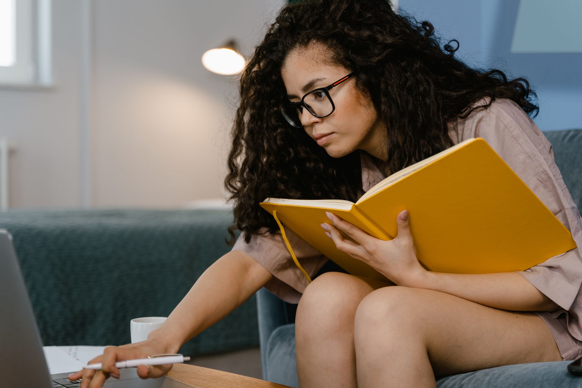 Woman working with a notebook and laptop