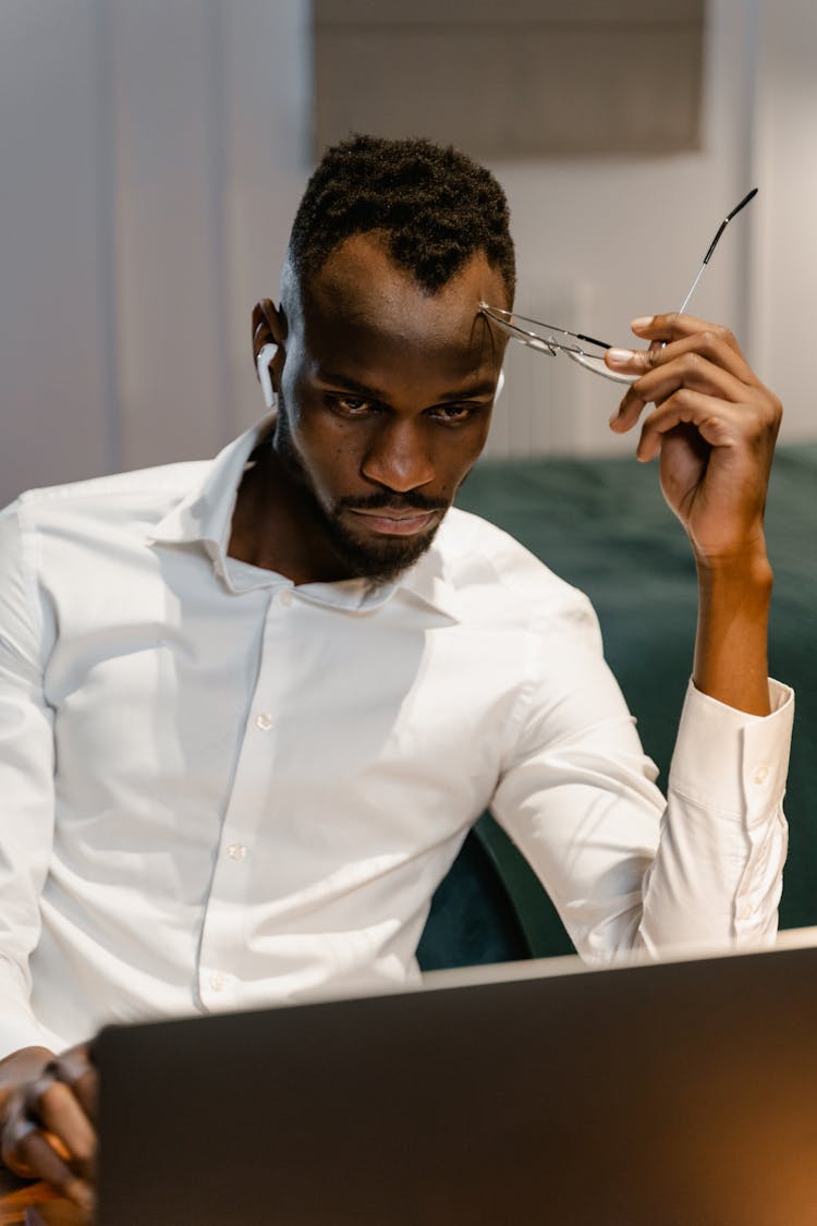 Man In White Long Sleeves Working In The Office