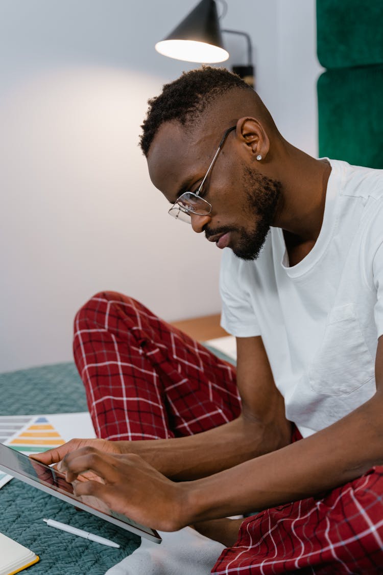 A Man Using An IPad