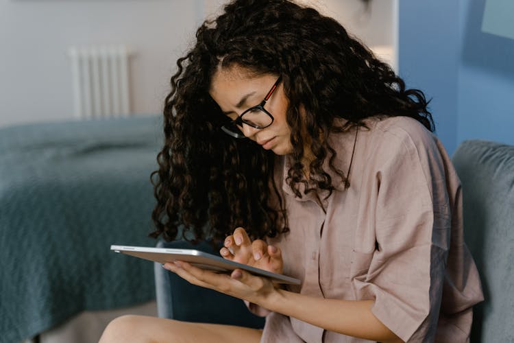 A Young Woman Using A Tablet