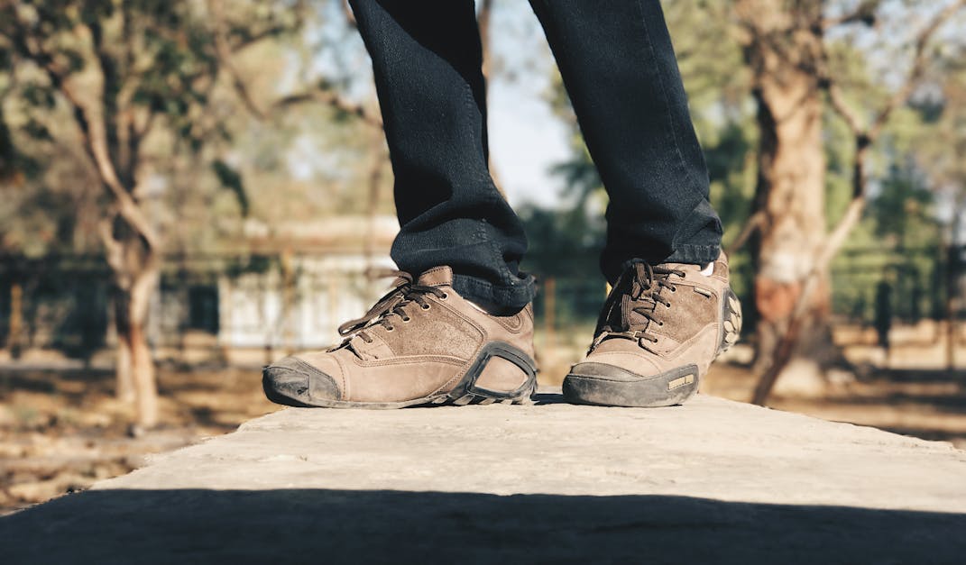 Selective Focus Photography of Person Wearing Brown Hiking Shoes · Free ...