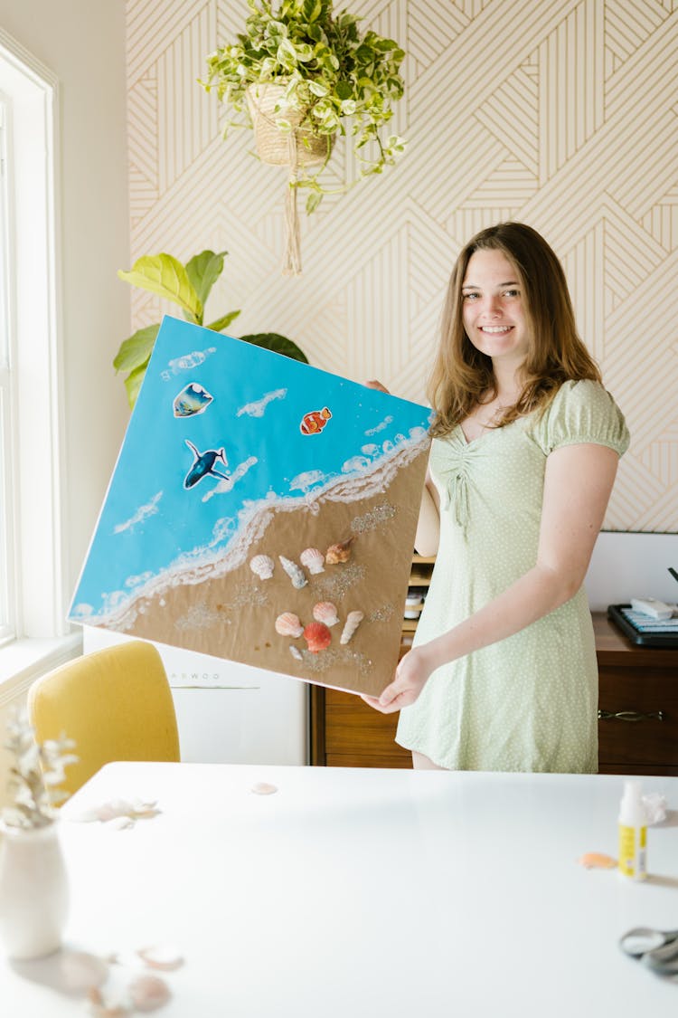 A Girl Holding A School Project