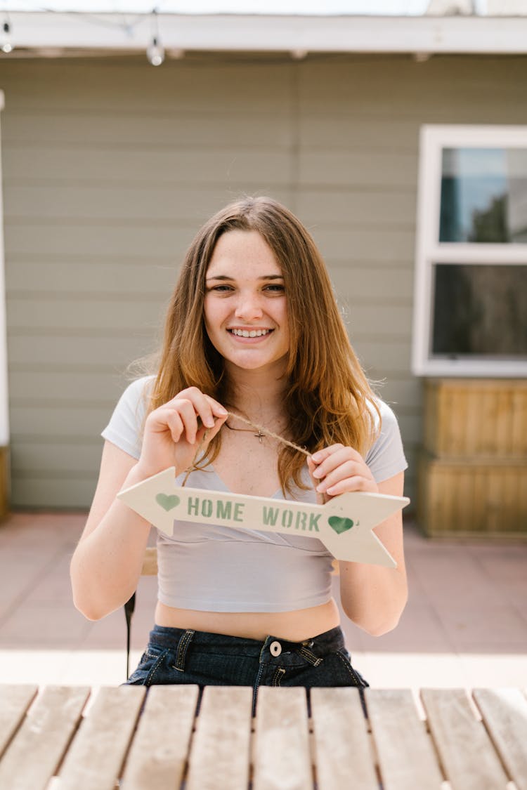 A Girl Holding An Arrow With String