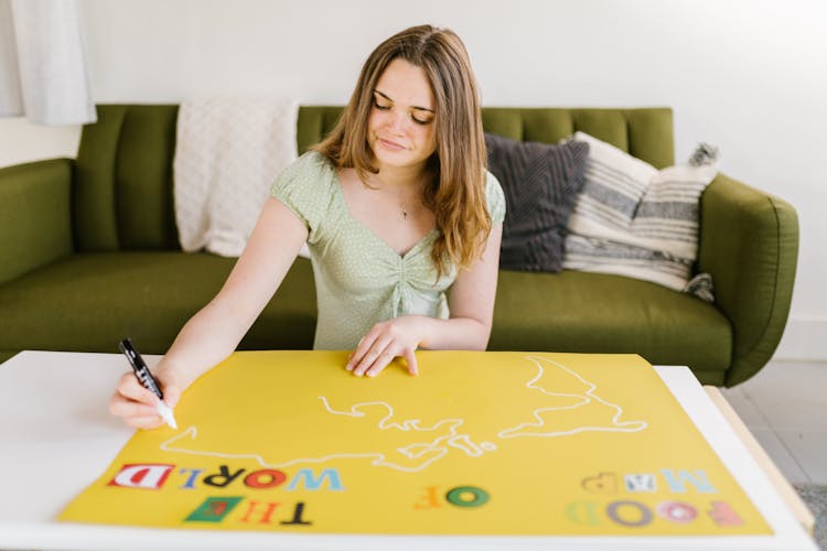 A Woman Making An Art Project