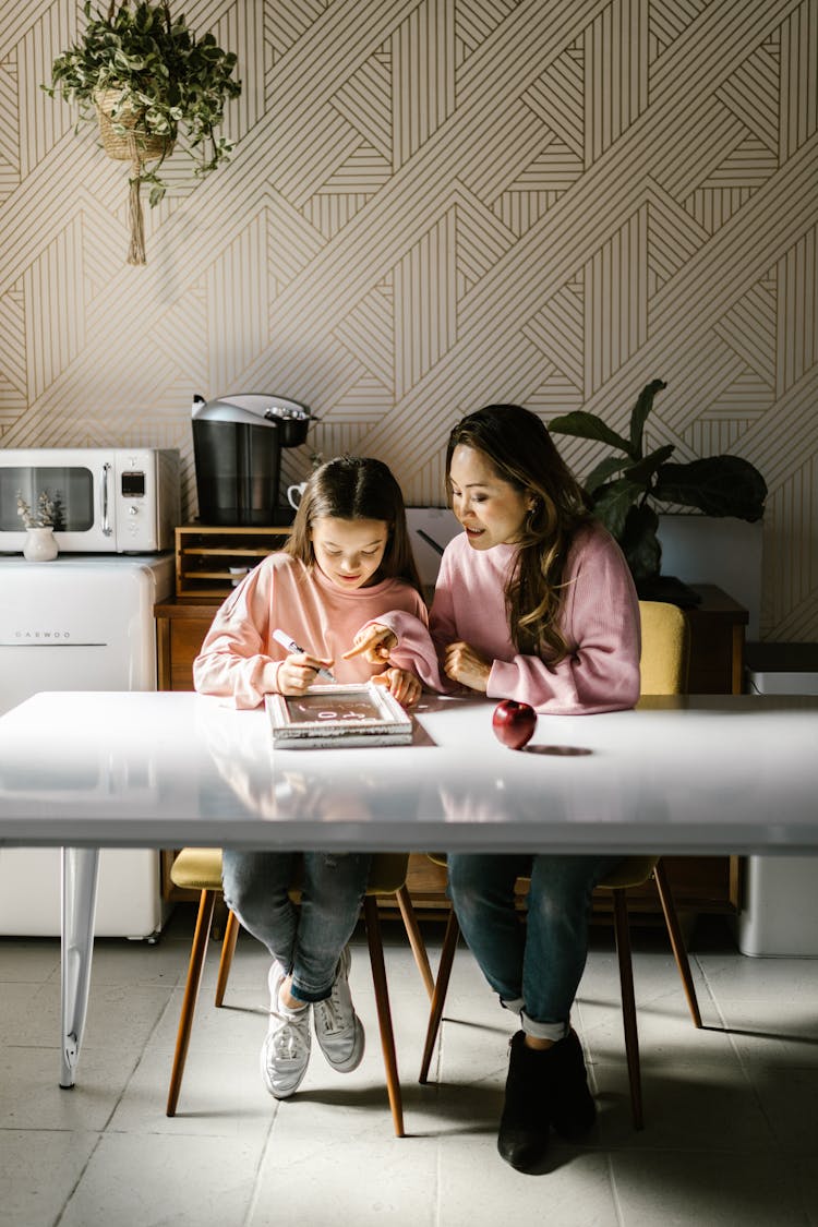 A Mother Teaching Her Daughter 