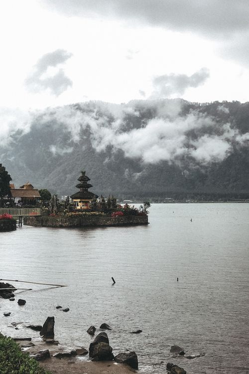 Free Peaceful landscape of Ulun Danu Beratan Temple by Lake Beratan in misty mountain setting Stock Photo