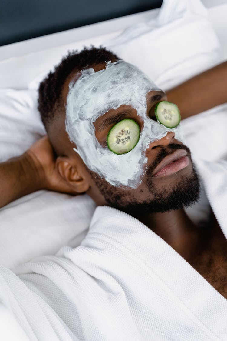 Man In Clay Mask And Cucumber Eye Mask 