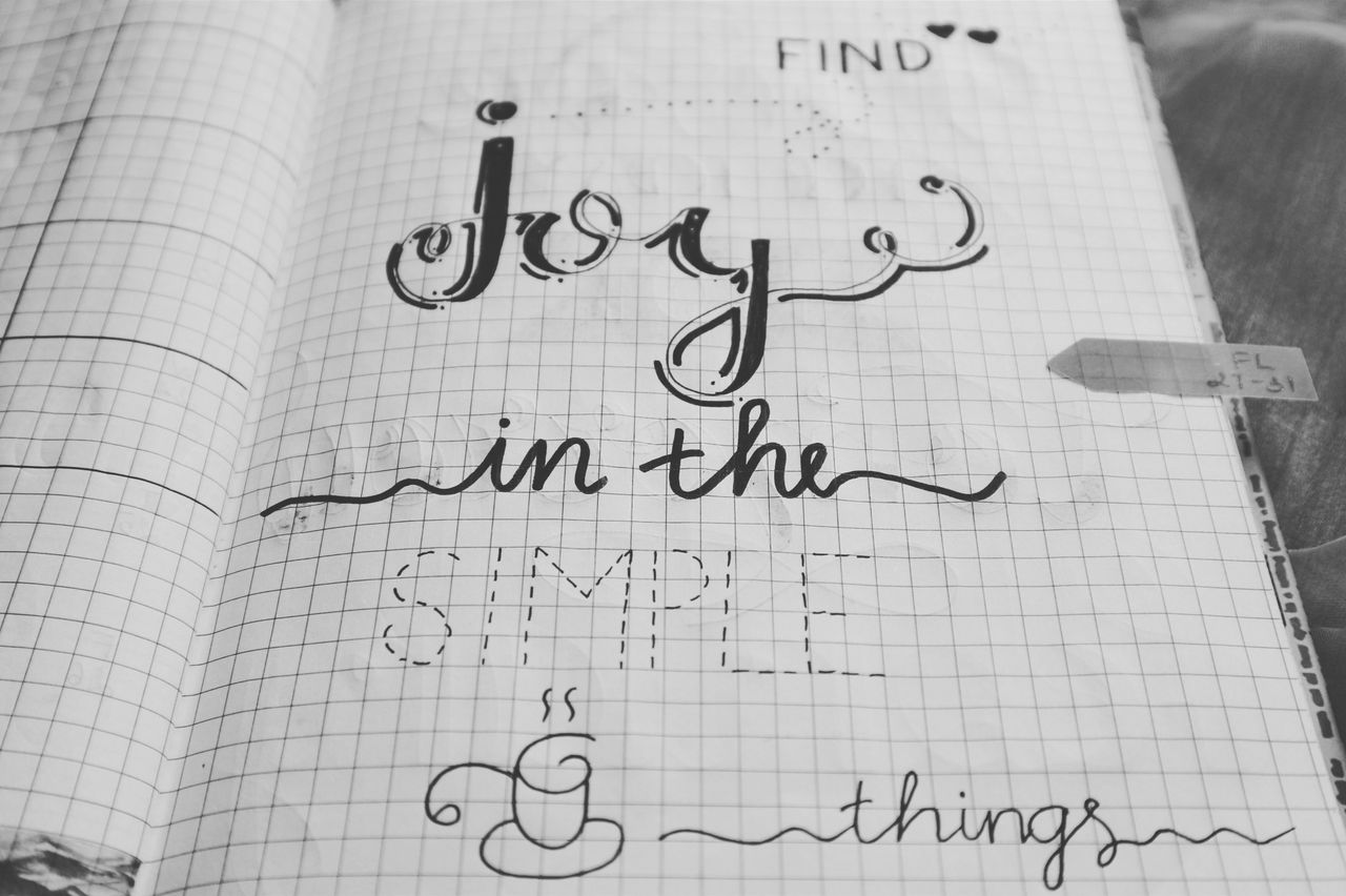 black and white image of a handwritten inspirational quote on a notebo