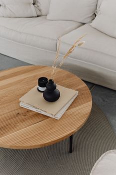 Books Vase and Candle on Short Coffee Table