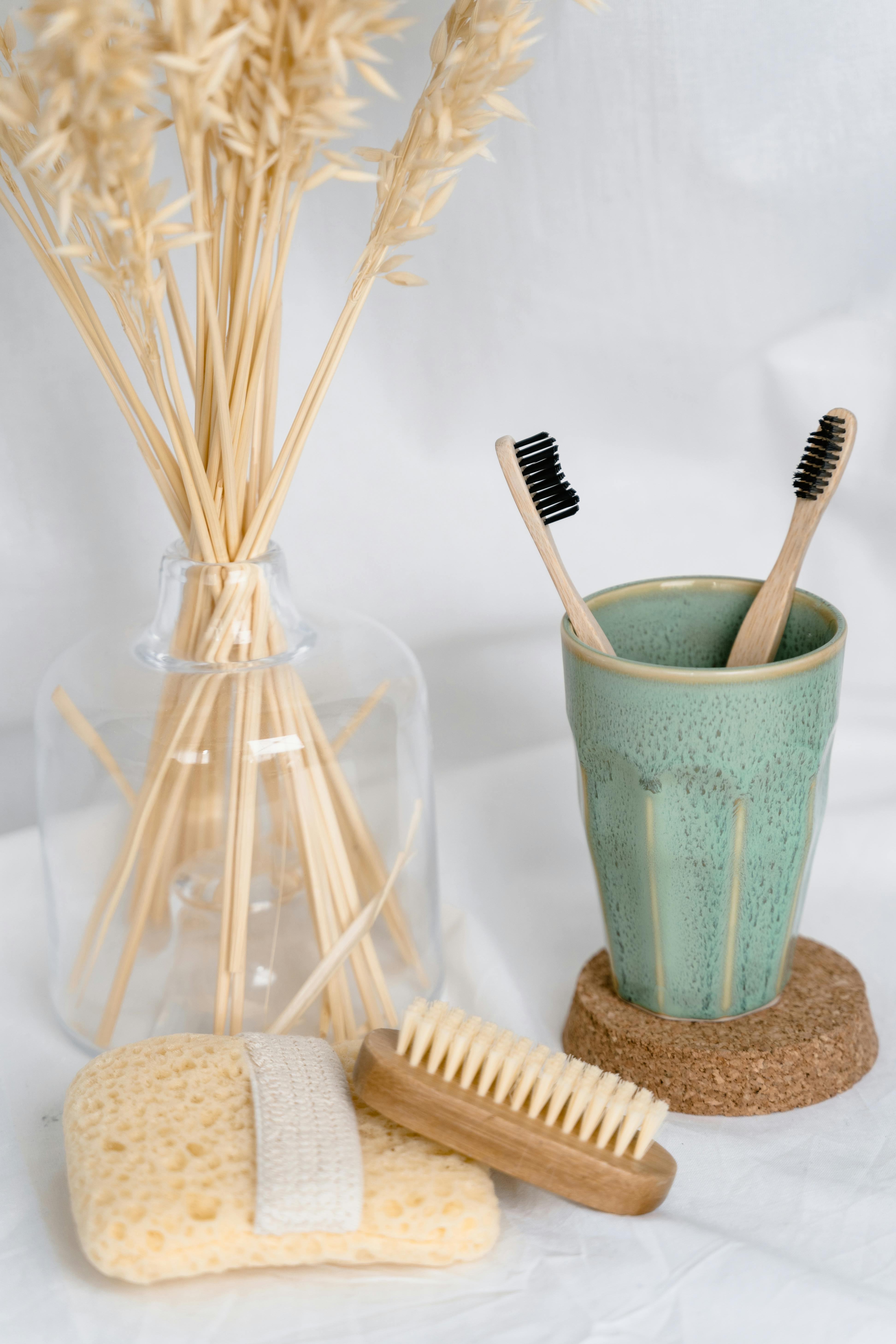 white and brown sticks in green bucket