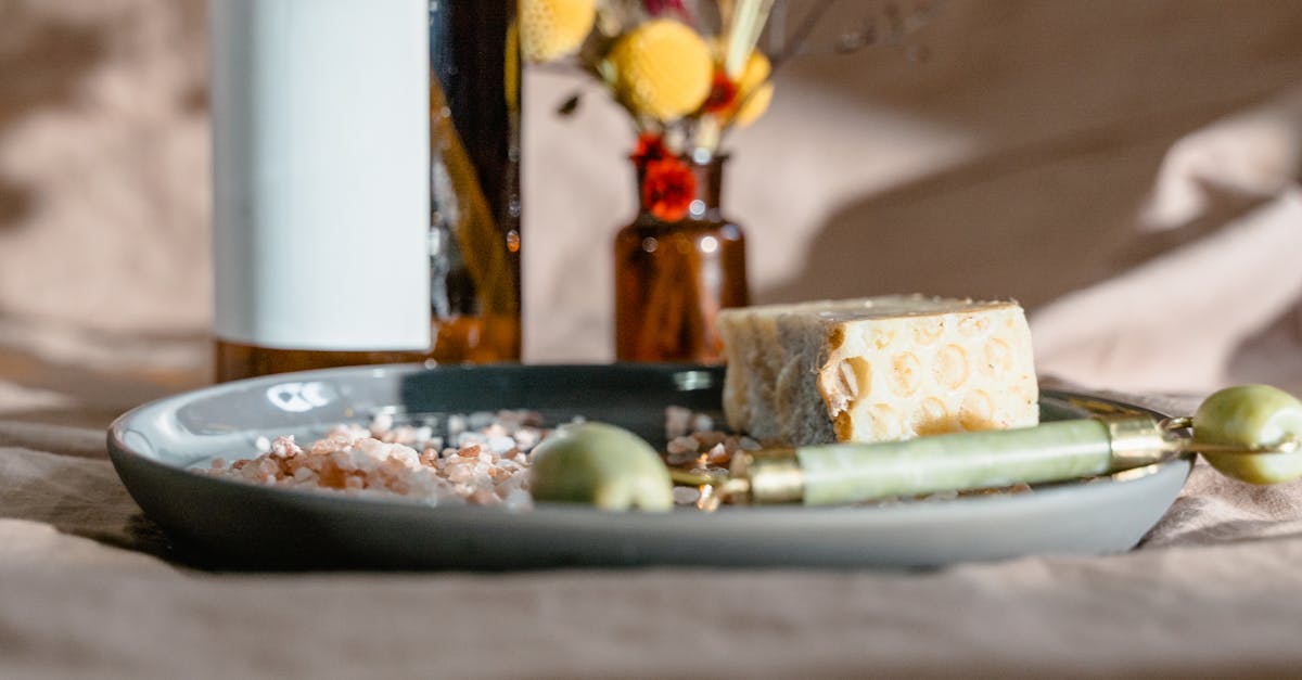 Elevate your self-care routine with this calming arrangement of spa essentials, including a jade roller and natural soap.