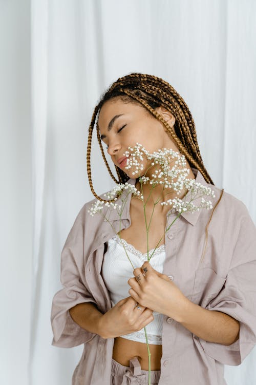 Woman Holding a Baby's Breath Flower