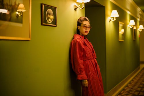 Woman in Red Dress Leaning on the Wall