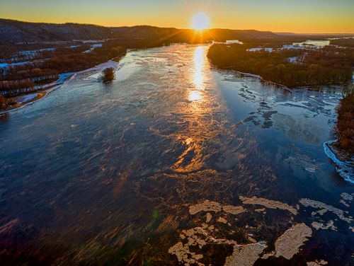 Free A breathtaking aerial view of the Mississippi River at sunset in West Newton, Minnesota. Stock Photo