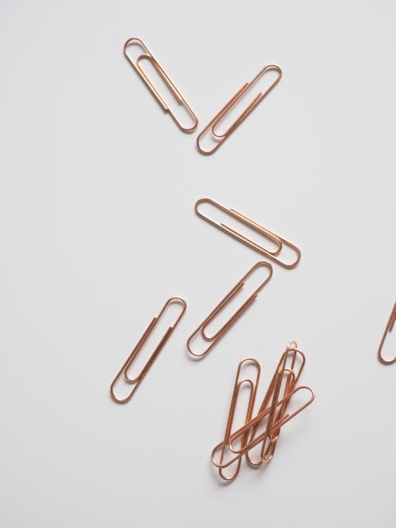 Paper Clips on White Surface