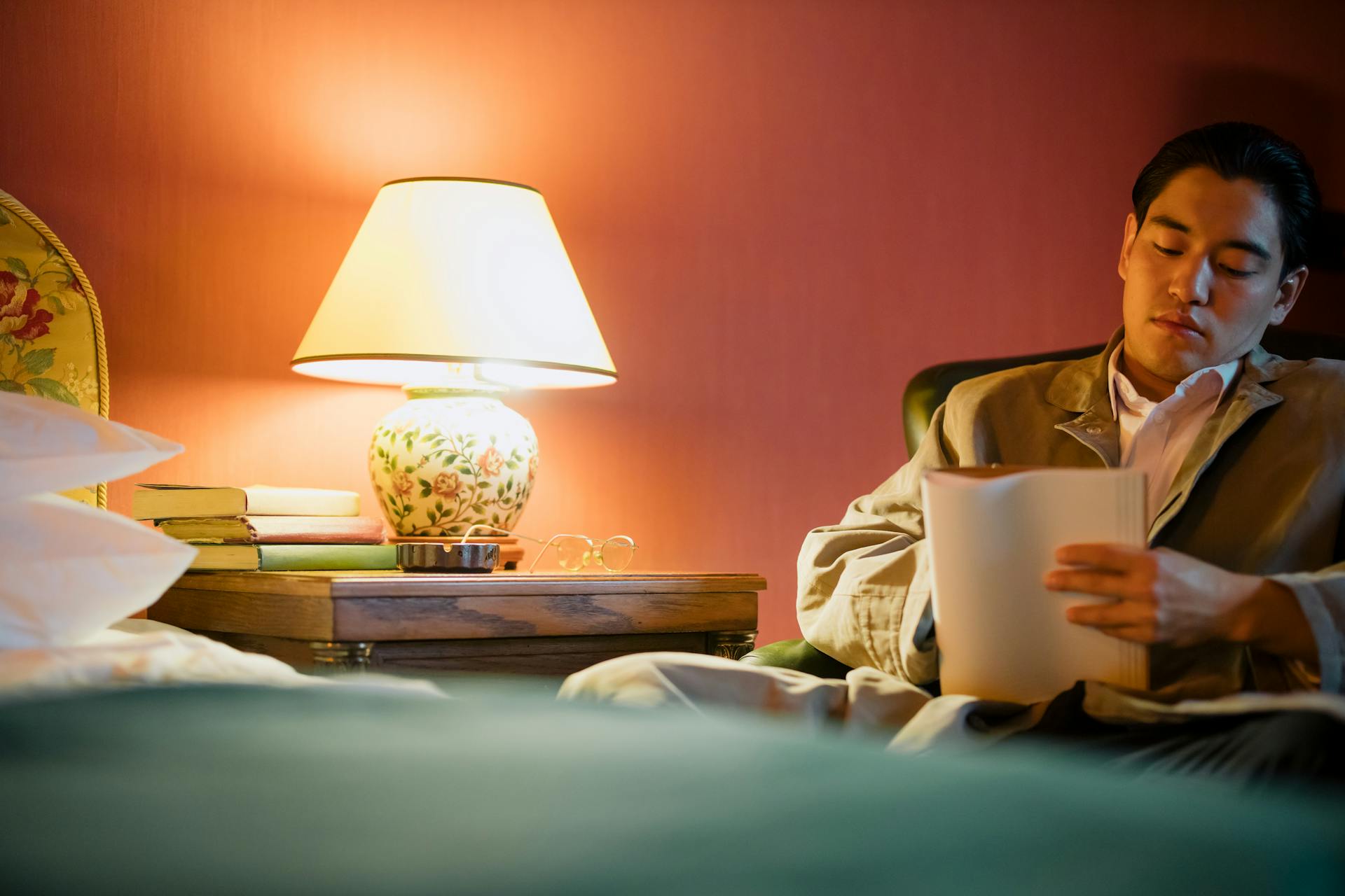 Man Writing on His Notebook