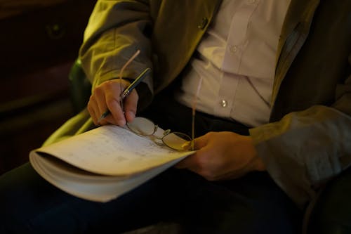 Free Man Holding a Notebook Stock Photo