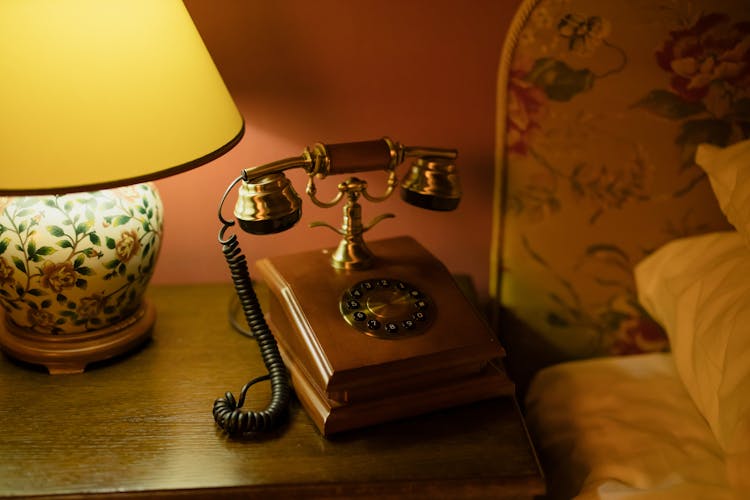 Vintage Telephone Beside The Bed